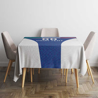 Blue tablecloth with stripe border on square dining table, four chairs