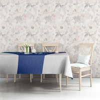 Blue tablecloth with stripe border on dining table with chairs, partly visible pattern