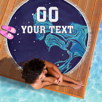 Round navy beach blanket with white fringe, custom text over blue wave flame graphics