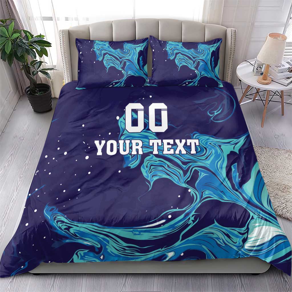 Custom rugby bedding set with dark blue and teal flame swirl print; two pillowcases show 'YOUR TEXT'.