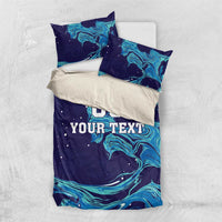 Custom rugby bedding set with teal flame swirl graphics on dark blue; 'DO YOUR TEXT' on duvet.