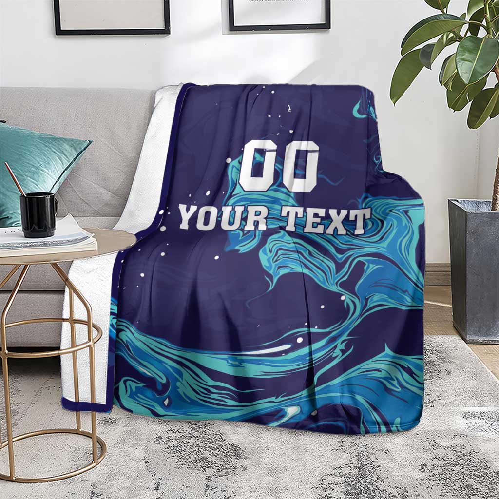 Customizable rugby blanket draped, dark navy with teal wave graphics and '00 YOUR TEXT'