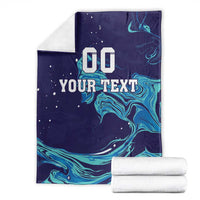 Folded customizable rugby blanket, dark navy with teal wave pattern and '00 YOUR TEXT'