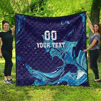 Dark blue quilt spread outdoors with teal flame waves and “00 YOUR TEXT” on top.