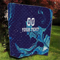 Dark blue quilt with teal flame waves; centered print shows “00 YOUR TEXT”.