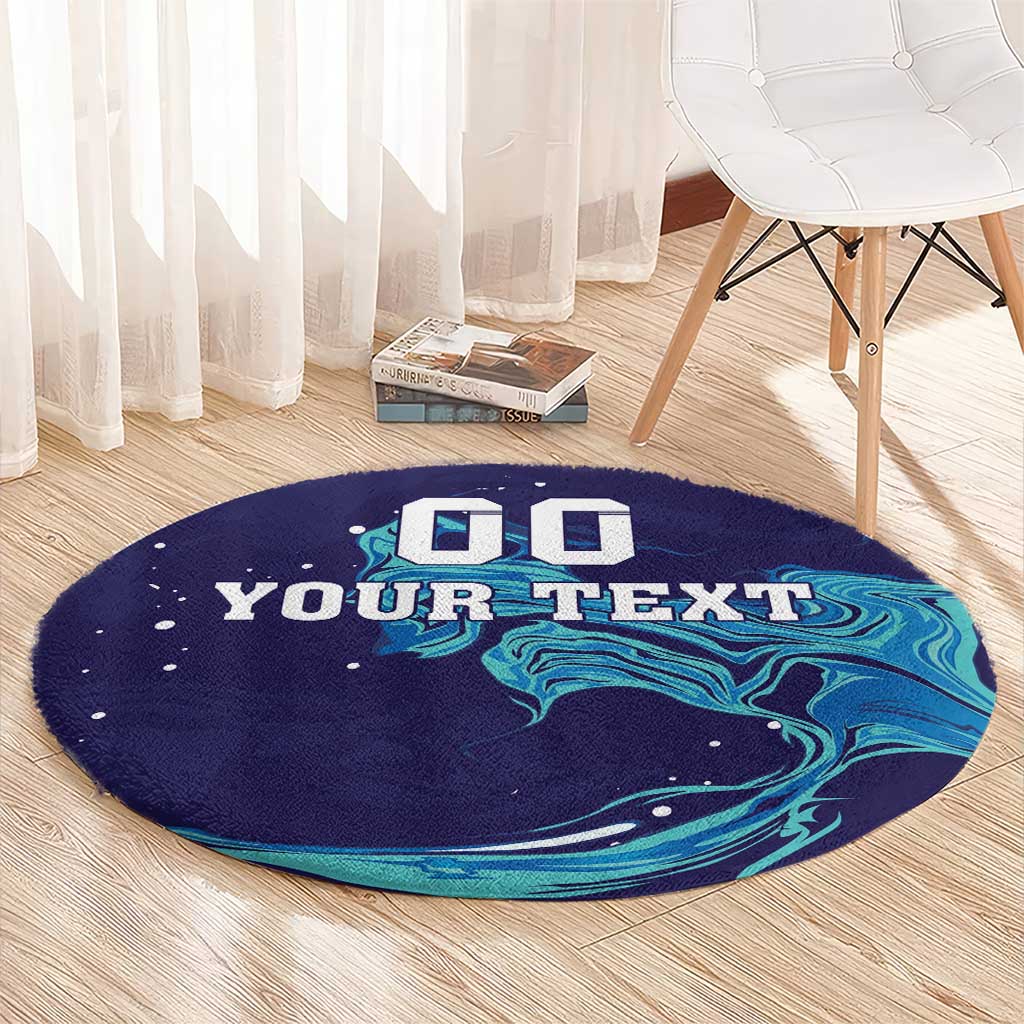 Round custom rug in navy with teal marbled waves and customizable 'YOUR TEXT'
