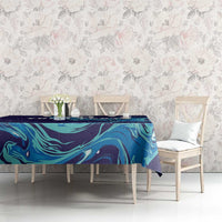 Custom rugby tablecloth, navy blue with teal flame-like swirl pattern across a dining table