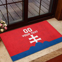 Red custom football rubber doormat with white number and text over blue bottom stripe