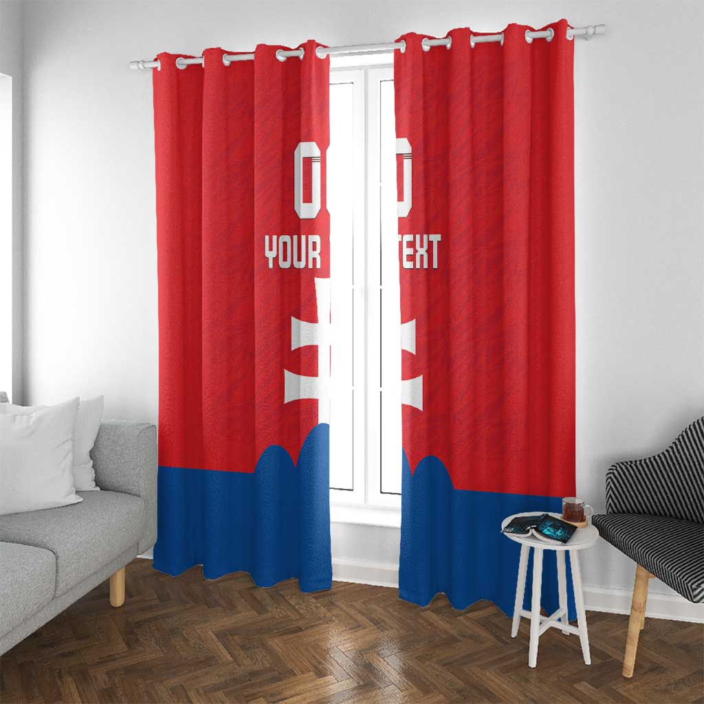 Red window curtains with white cross and custom text, blue bottom stripe on hanging hooks.