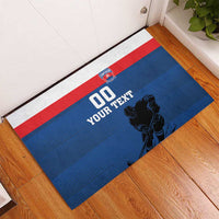 Blue hockey rubber doormat with red/white stripe band, '00 YOUR TEXT', and player graphic.