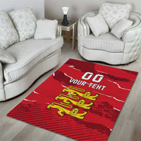 Red area rug with white “00 YOUR TEHT” text and yellow lion crest