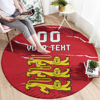 Red round sporty carpet rug with custom text and yellow cartoon lions, shown on floor