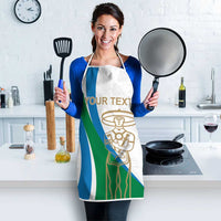 White apron with blue/green stripe design and gold emblem; neck loop and waist ties