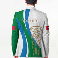 White blazer back with green/blue stripes, 'YOUR TEXT' print, and large crest emblem
