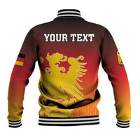 Back of red baseball jacket with striped ribbing and YOUR TEXT coat of arms print