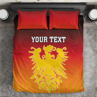 Red bedding set with yellow coat of arms print and “YOUR TEXT” on duvet and pillows