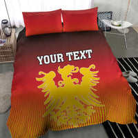 Red bedding set showing yellow coat of arms and “YOUR TEXT” centered on duvet