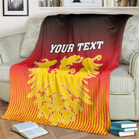 Personalized Germany blanket on armchair, YOUR TEXT and gold winged lion crest