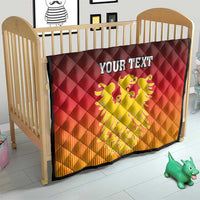 Personalized crib quilt with German coat of arms, red-to-orange gradient, black trim, diamond quilting