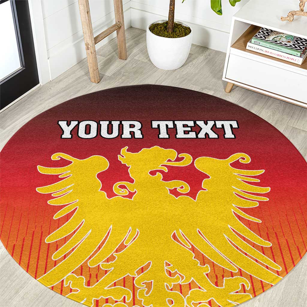 Close-up of round red carpet with gold Germany coat of arms and custom text
