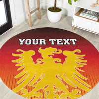 Close-up of round red carpet with gold Germany coat of arms and custom text