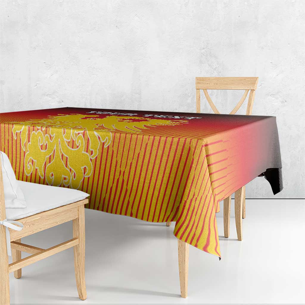 Red and gold striped tablecloth with centered coat of arms motif