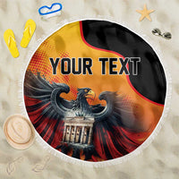 Round beach blanket with white fringe, eagle graphic on black and 'YOUR TEXT'.