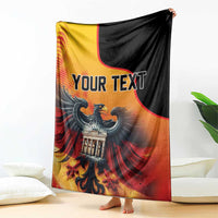 Personalized throw blanket with bold “YOUR TEXT” and eagle over Berlin Wall graphic.