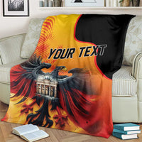 Personalized blanket with “YOUR TEXT,” eagle and Berlin Wall image, black edge.