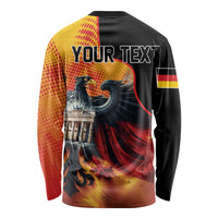 Black long-sleeve shirt with eagle graphic; back says "Your Text" with Berlin Wall scene