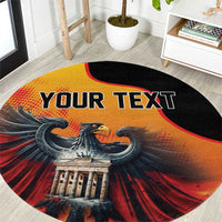 Personalized round carpet with eagle graphic and "YOUR TEXT" across black edge