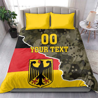 Germany 1990 bedding set showing camo flag print with crest, “00 YOUR TEXT”, and two yellow pillows