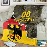 Green camo Germany blanket featuring crest graphic, red band, yellow base, and “YOUR TEXT”