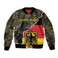 Camo bomber jacket with front zipper; graphic shows 'DEUTSCHLAND' and eagle shield