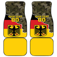 Pair of custom car floor mats with green camo top, yellow base, crest, “YOUR TEXT 00”