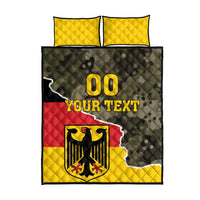 Quilt bed set with two yellow pillow shams and comforter, dark camo, eagle crest and “00”.