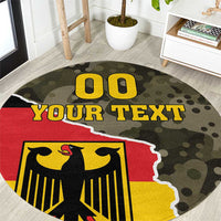 Round red, yellow, and green camouflage carpet with eagle crest and bold 'YOUR TEXT'