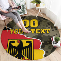 Round camouflage carpet with eagle crest, large 'YOUR TEXT' lettering, and red-yellow shield
