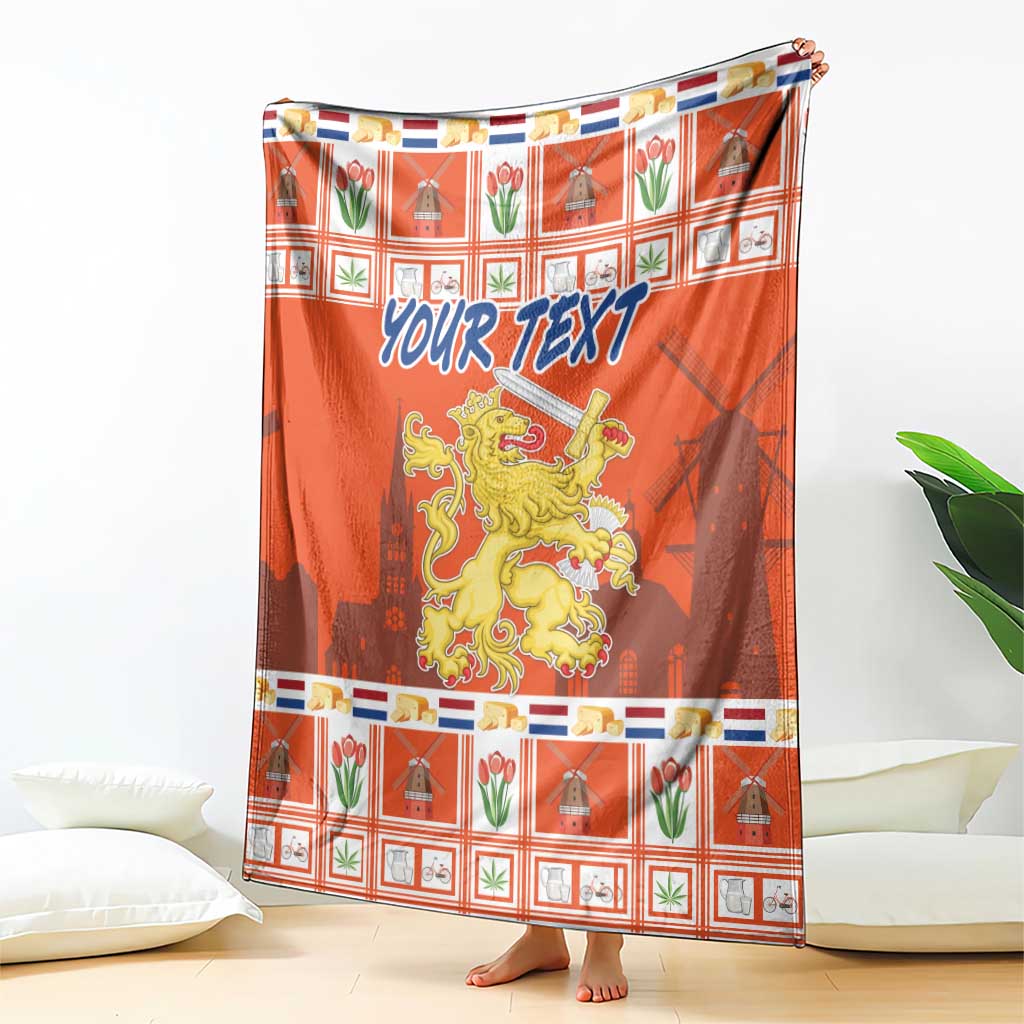 Orange blanket coat with lion crest and 'YOUR TEXT' text over plaid holiday pattern