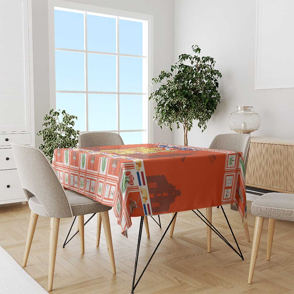 Orange Christmas tablecloth with Dutch coat of arms design over a dining table.