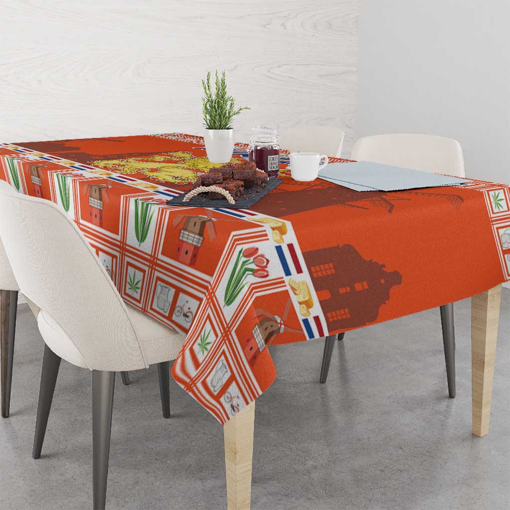 Orange Dutch Christmas tablecloth with coat of arms pattern draped on a dining table.