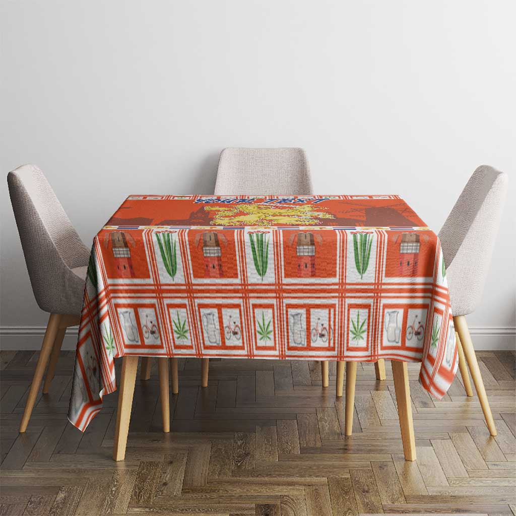 Orange Christmas tablecloth with Dutch coat of arms pattern on a rectangular dining table.
