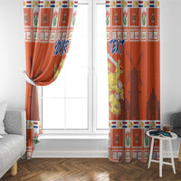 Orange window curtain panels with Dutch crest print and blue “YOUR TEXT”, tied at side