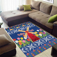 Blue Christmas area rug featuring a windmill, tulips, and 'Prettige Kerst' text