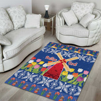 Blue Christmas area rug with windmill motif, tulip flowers, and 'Prettige Kerst'
