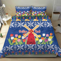 Blue duvet and pillowcases set with tulip flowers, windmill art, and white geometric trim