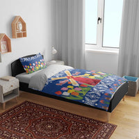 Blue Christmas duvet cover on bed with tulip flowers and windmill center artwork