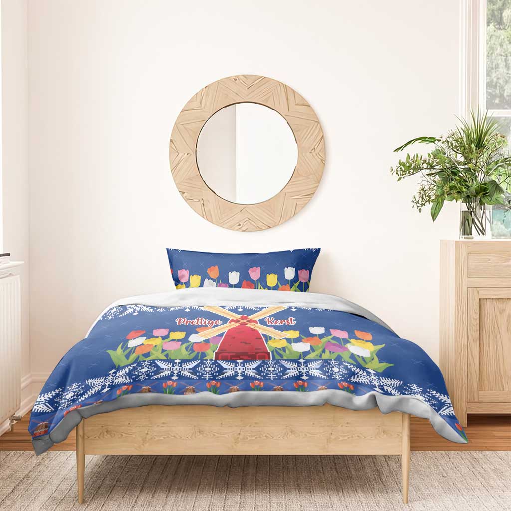 Blue Christmas duvet cover with tulip flowers and windmill motif on a wooden bed