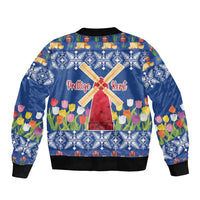 Unisex blue bomber jacket with back text 'Prettige Kerst', windmill, and tulips