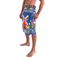 Blue tulip and windmill print lava-lava shorts, side view with multicolor tulip scene